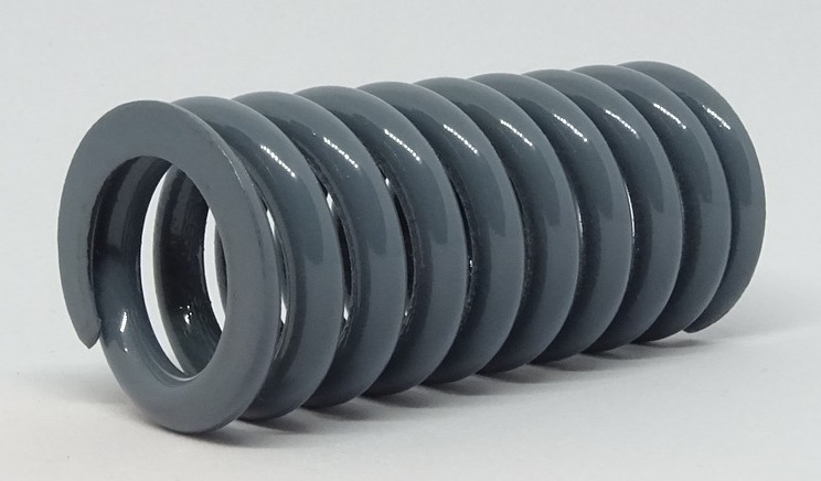 Image of a grey metal compression spring