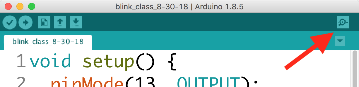 Screenshot showing a red arrow pointing to the upper right corner of the Arduino IDE window, there where is a small magnifying glass icon. In the Arduino IDE, this same feature can be accessed using shift-command-m.