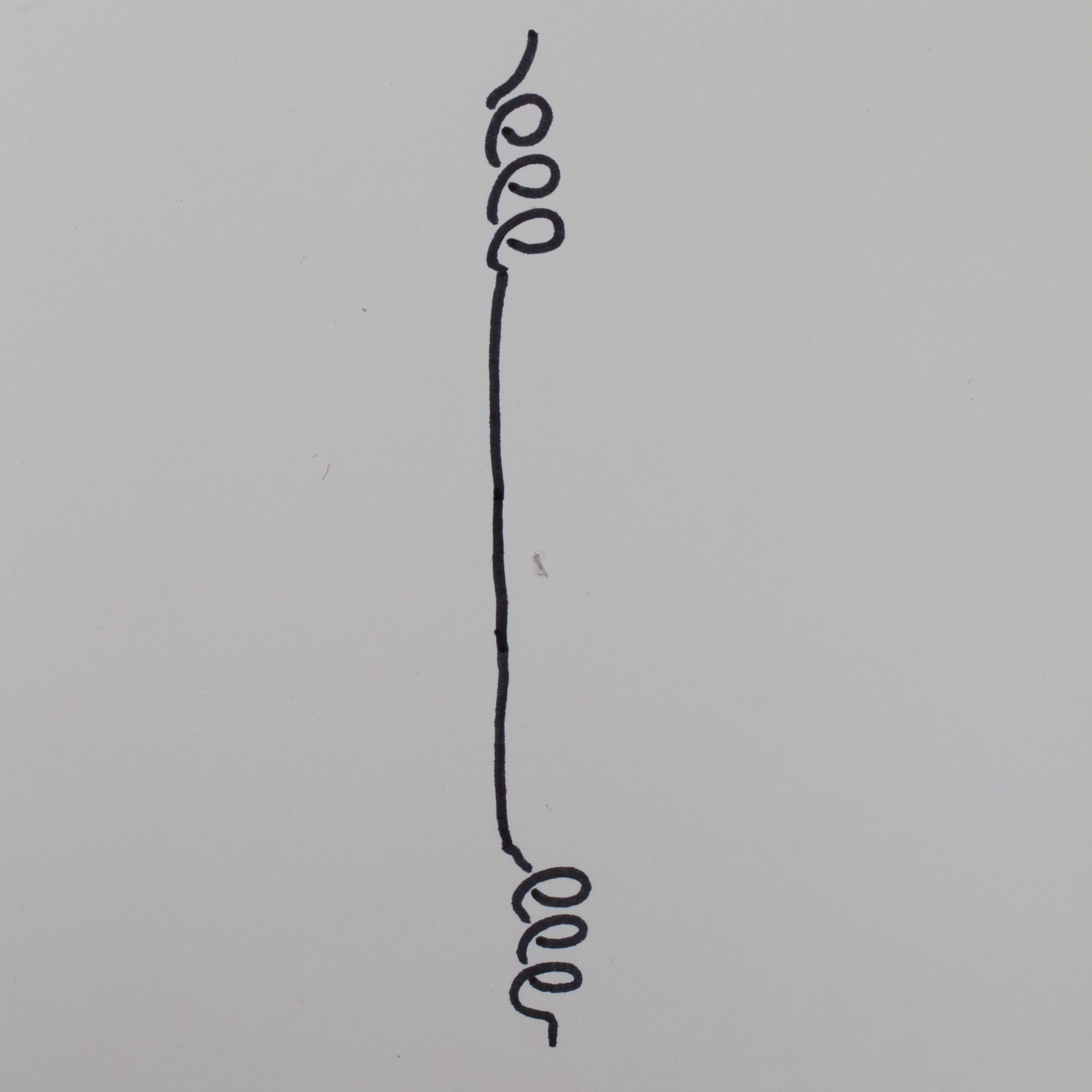 Diagrammatic drawing: a wire is represented showing that there is a section of coil towards the 12 o'clock on the page, then a straight wire section connecting it to another section of coil towards the 6 o'clock on the page.
