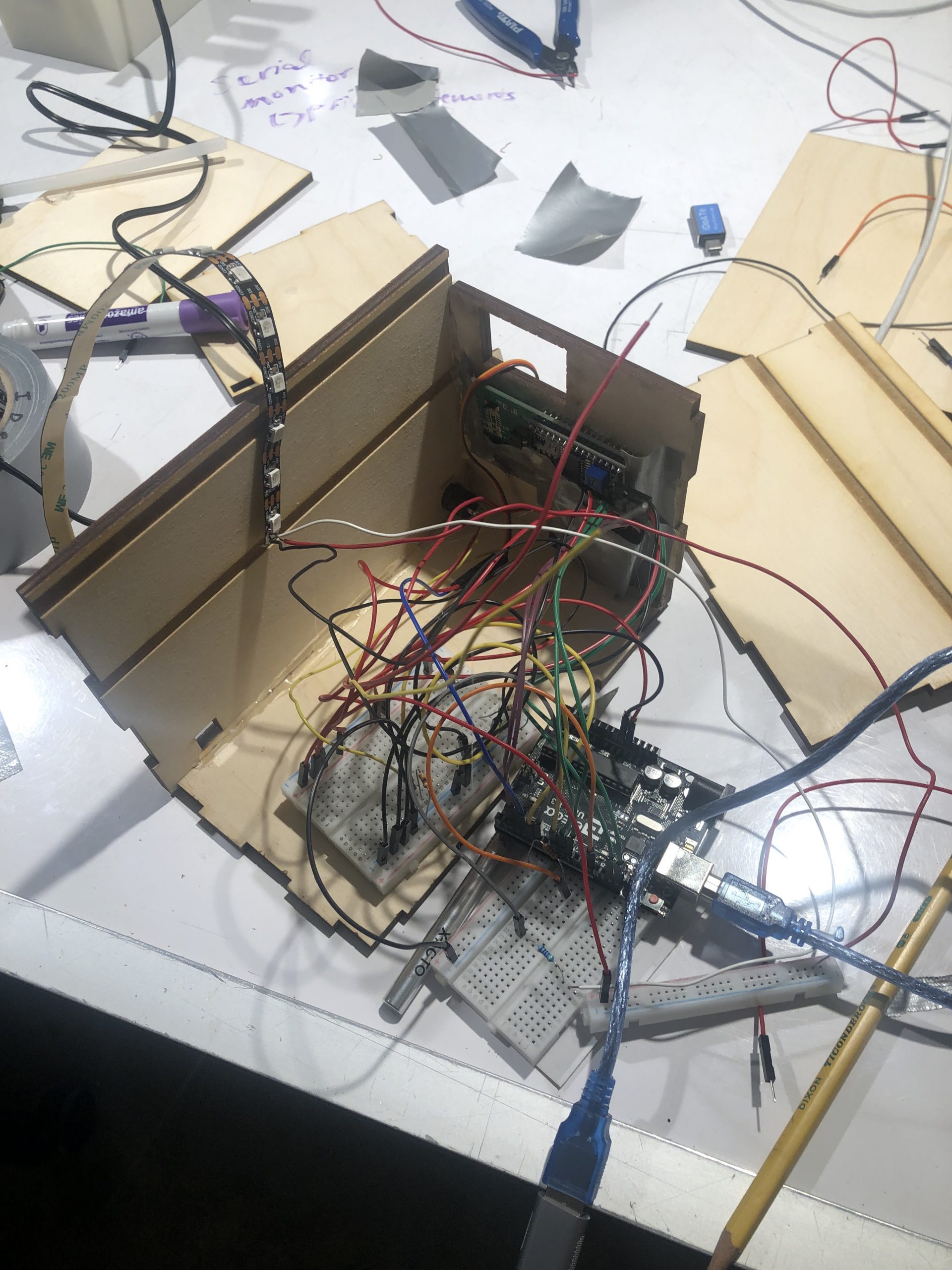 two walls of the box built and trying to fit wiring inside