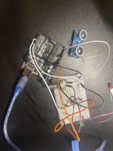 An image of a potentiometer and LED in a breadboard with an arduino