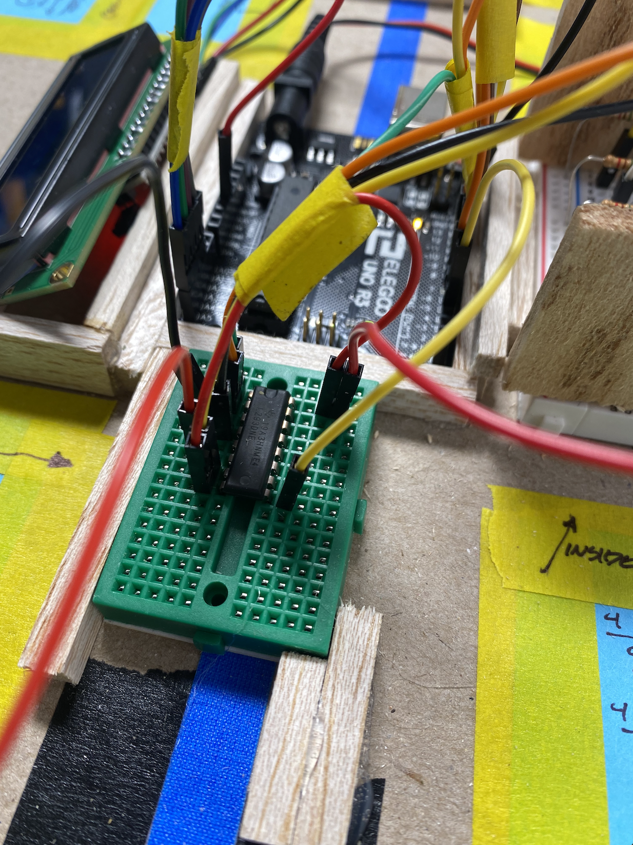 Image of breadboard with L293D Motor Driver and cables attaching to Arduino and dc motor