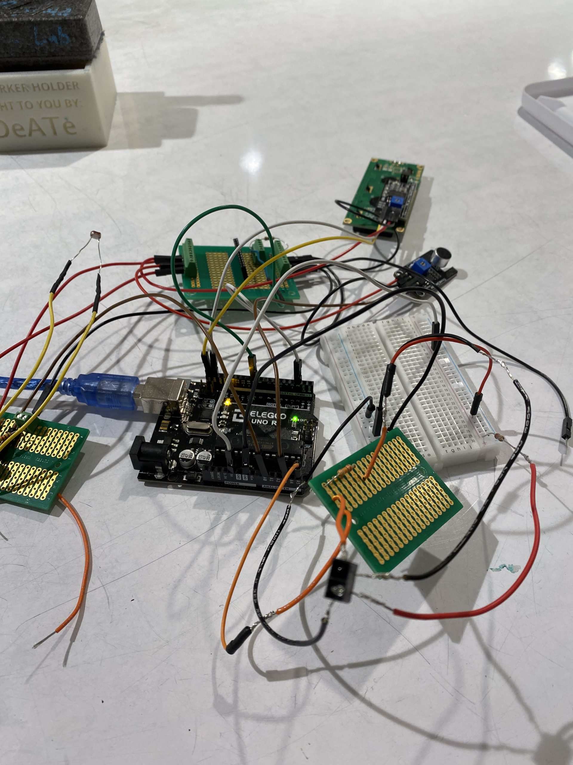 A series of soldered boards connected to an Arduino.