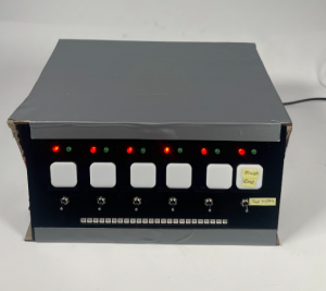 black front panel of box; all switches are in the down position, all lights are flashing red