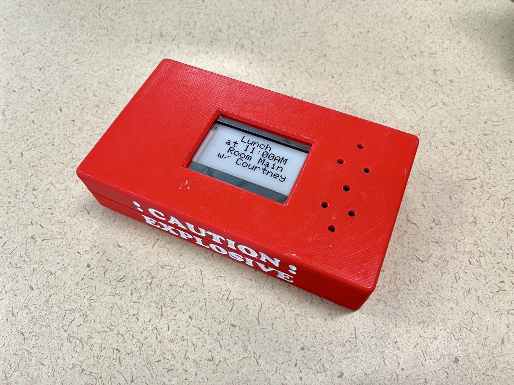 Bright red box with a small white screen in the center displaying details about a class