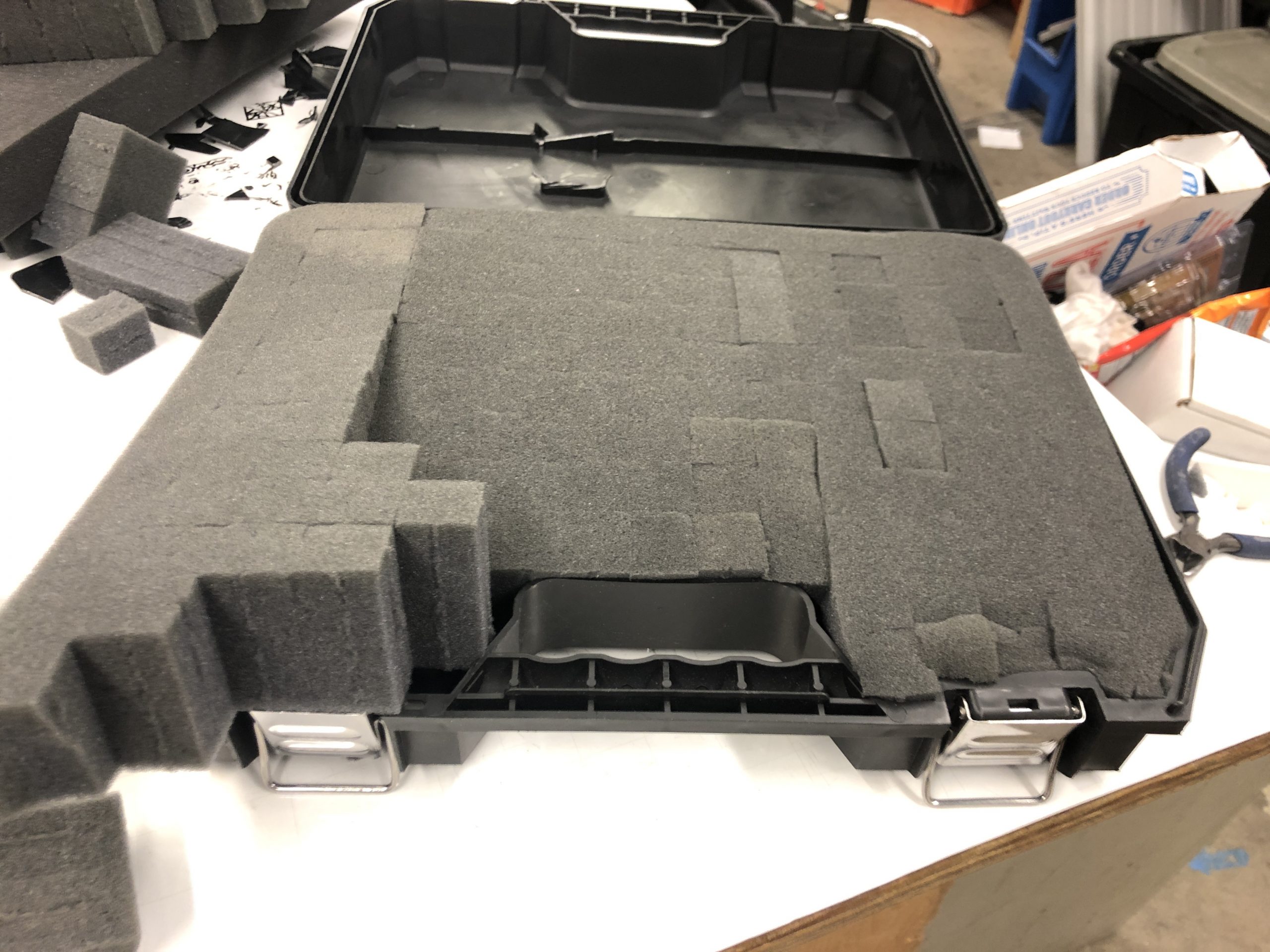 Prepping the foam to fit into the case. I had to cut down much of the foam for it to even go in the bounds, and even then it looked a bit patchy. 